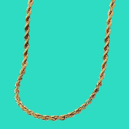 Gold rope chain necklace on a turquoise background
