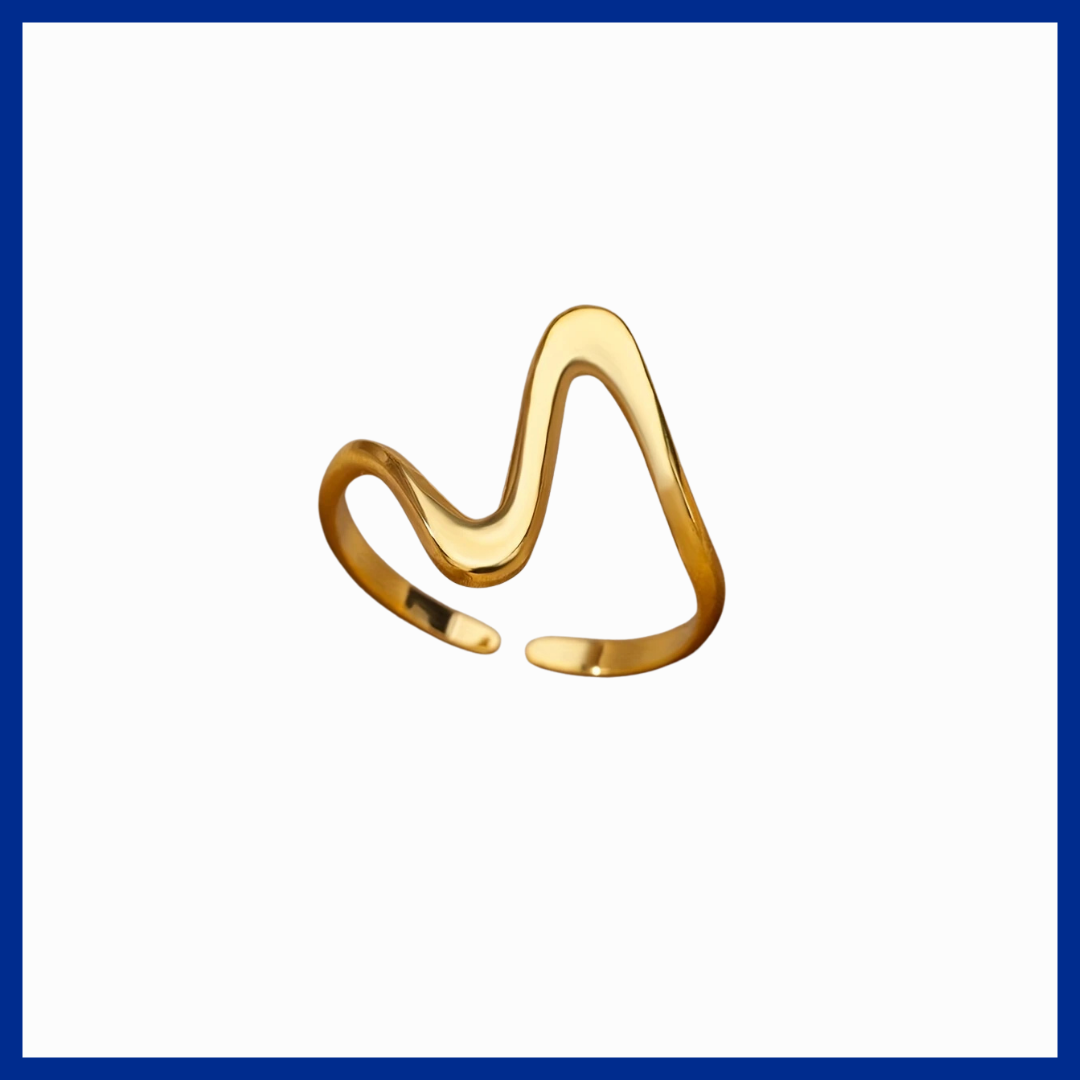 Gold ring with a wavy design on a white background