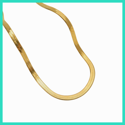 Gold chain necklace on a white background