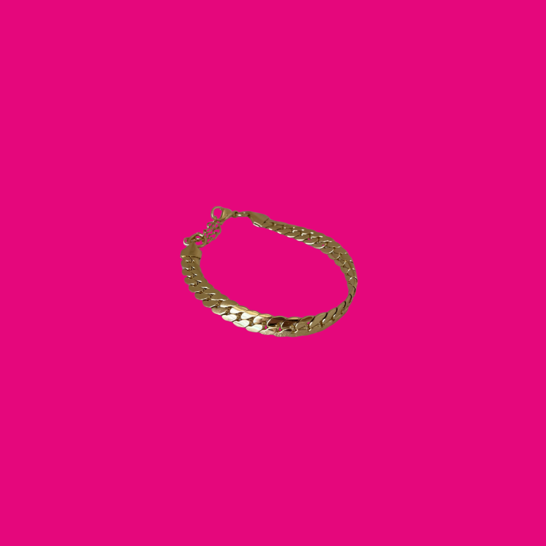 Gold chain bracelet on a pink background