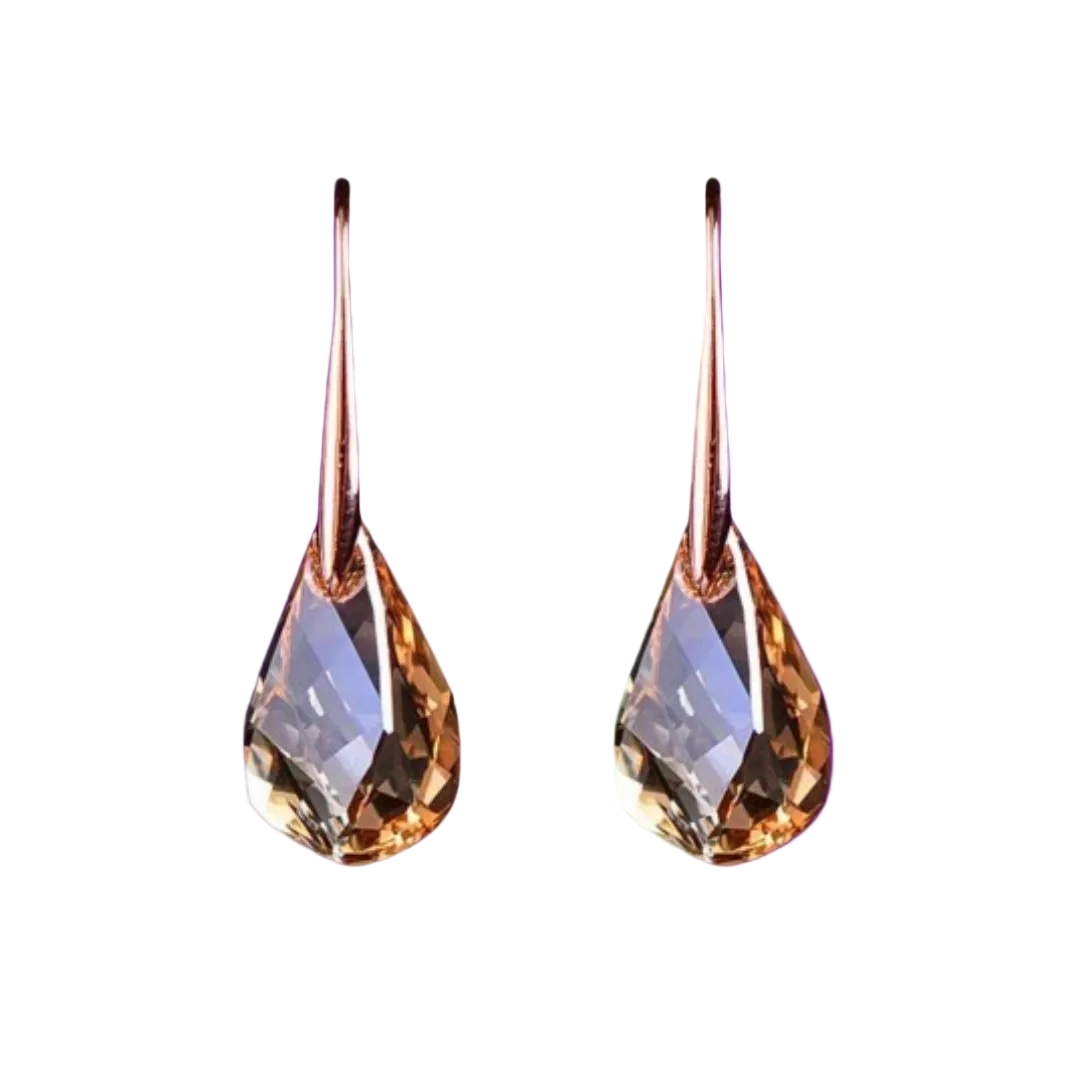 Teardrop-shaped earrings with a metallic finish on a white background