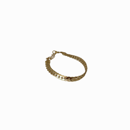 Gold bracelet on a white background