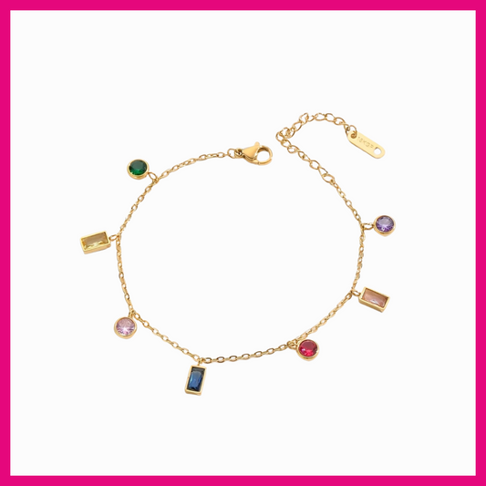 Gold bracelet with colorful gemstones on a white background