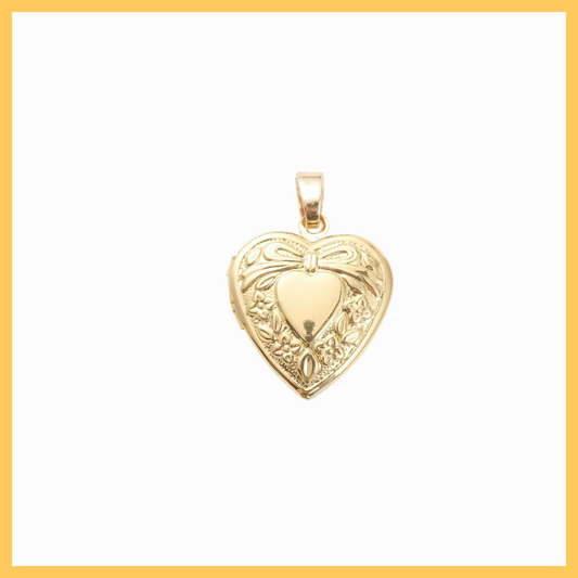 Gold heart-shaped pendant on a white background
