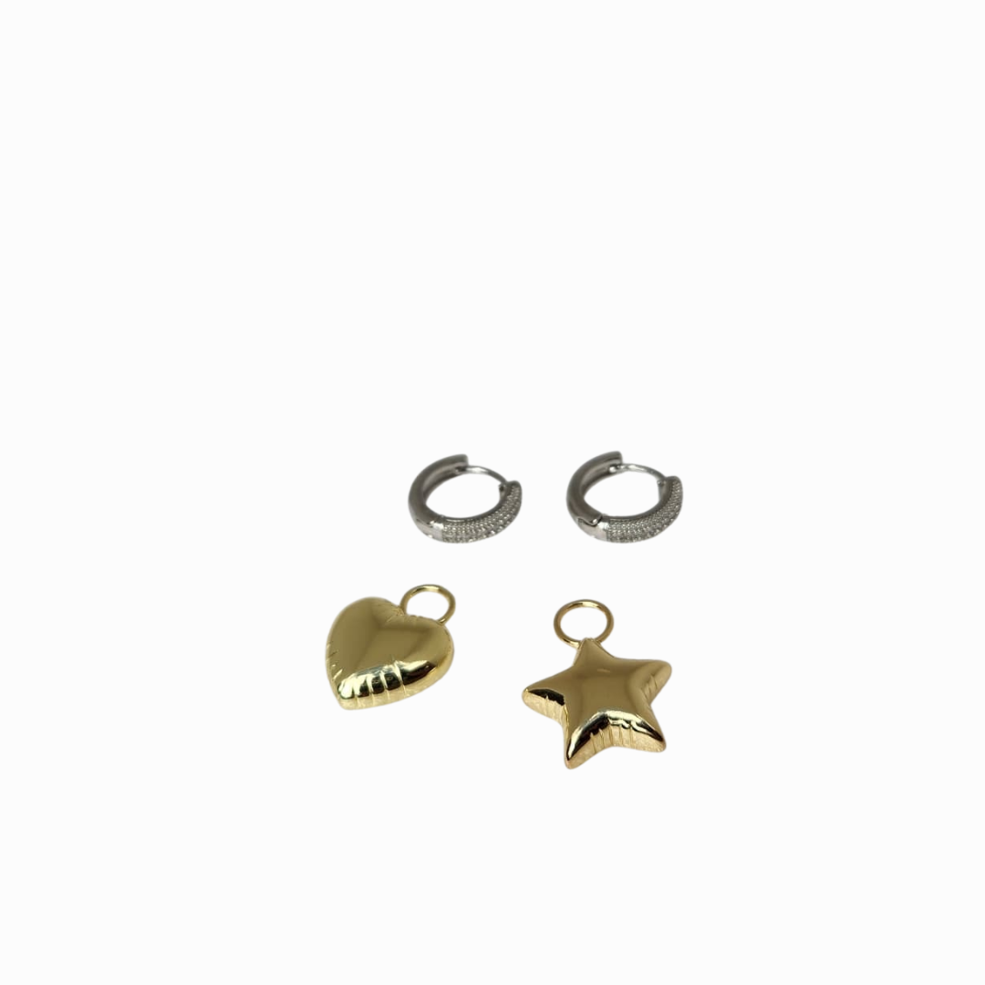 Gold heart and star charms with silver hoop earrings on a white background