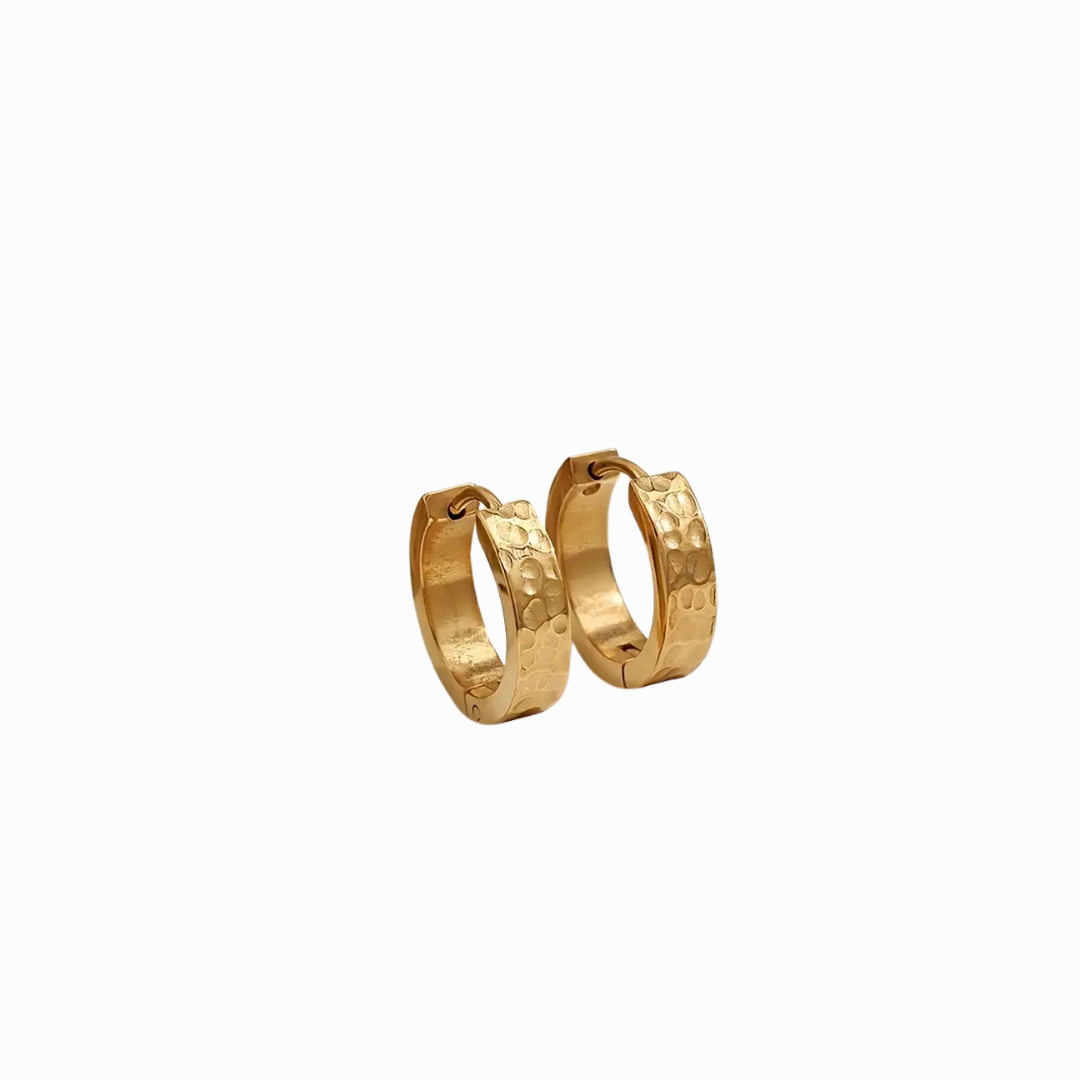 Gold hoop earrings on a white background