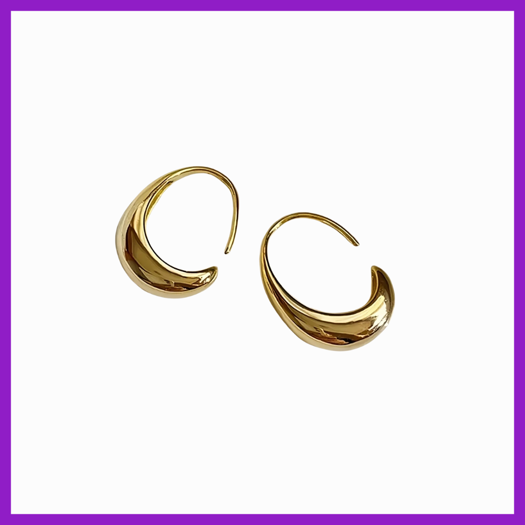 Gold hoop earrings on a white background