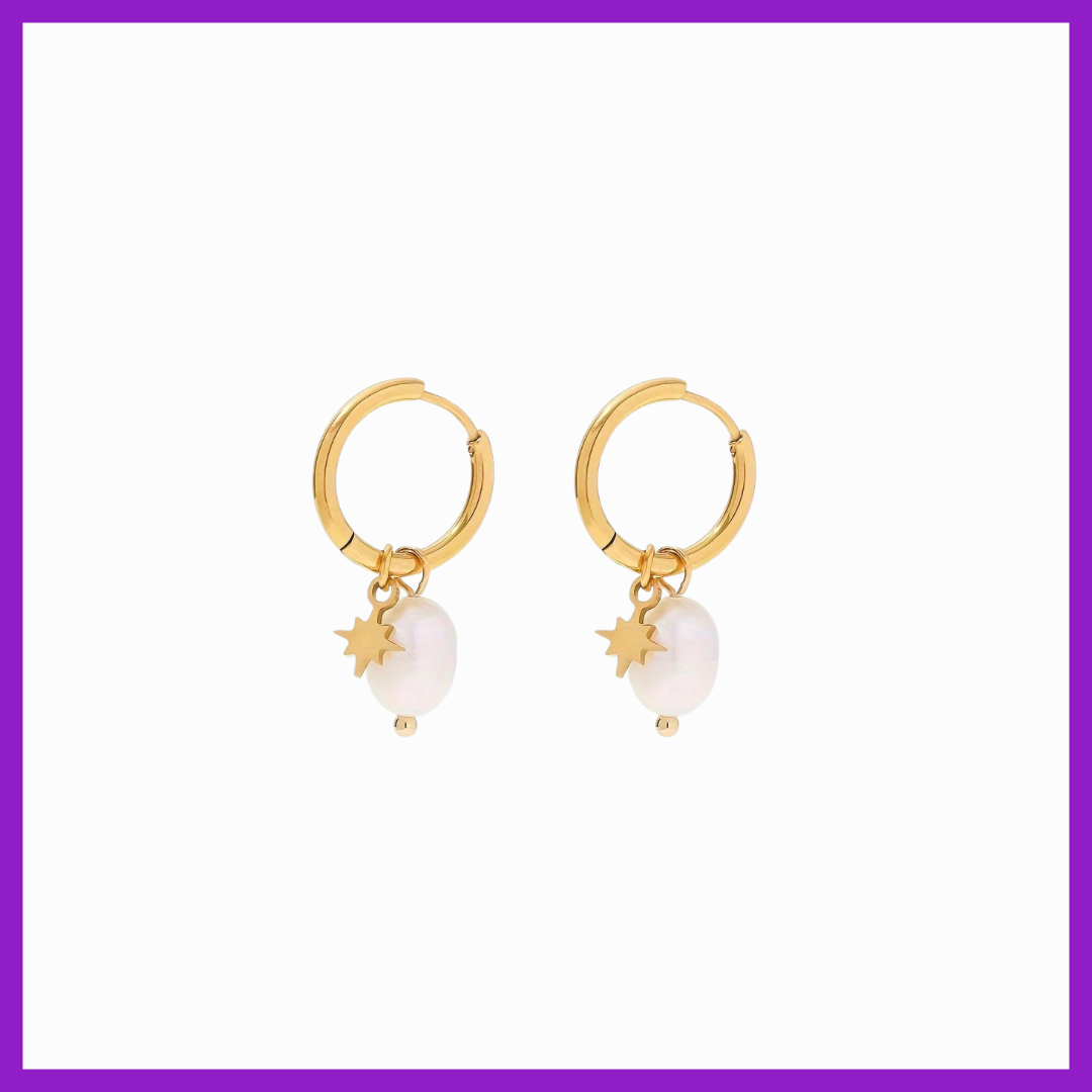 Gold hoop earrings with pearl and star charms on a white background