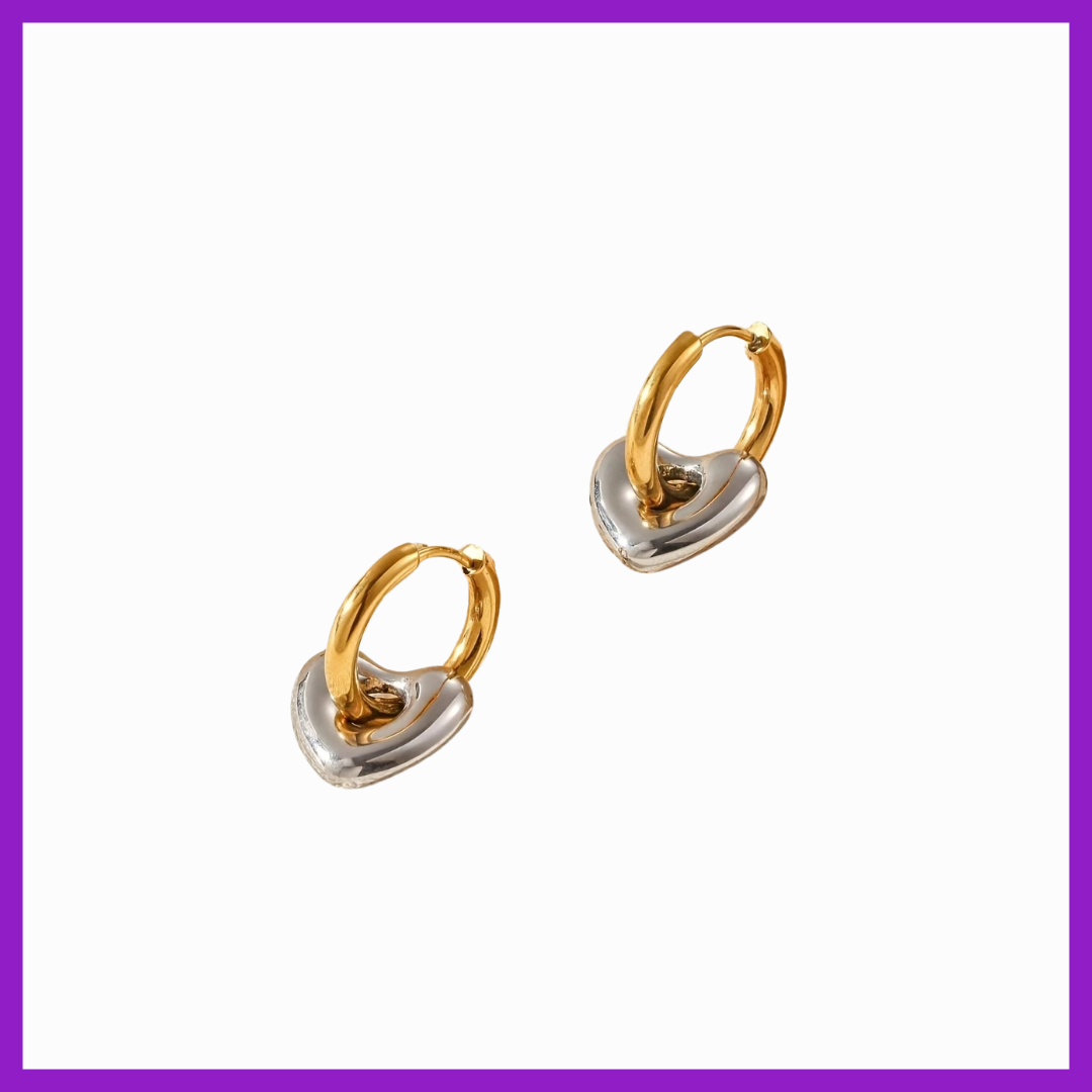 Pair of gold and silver hoop earrings on a white background