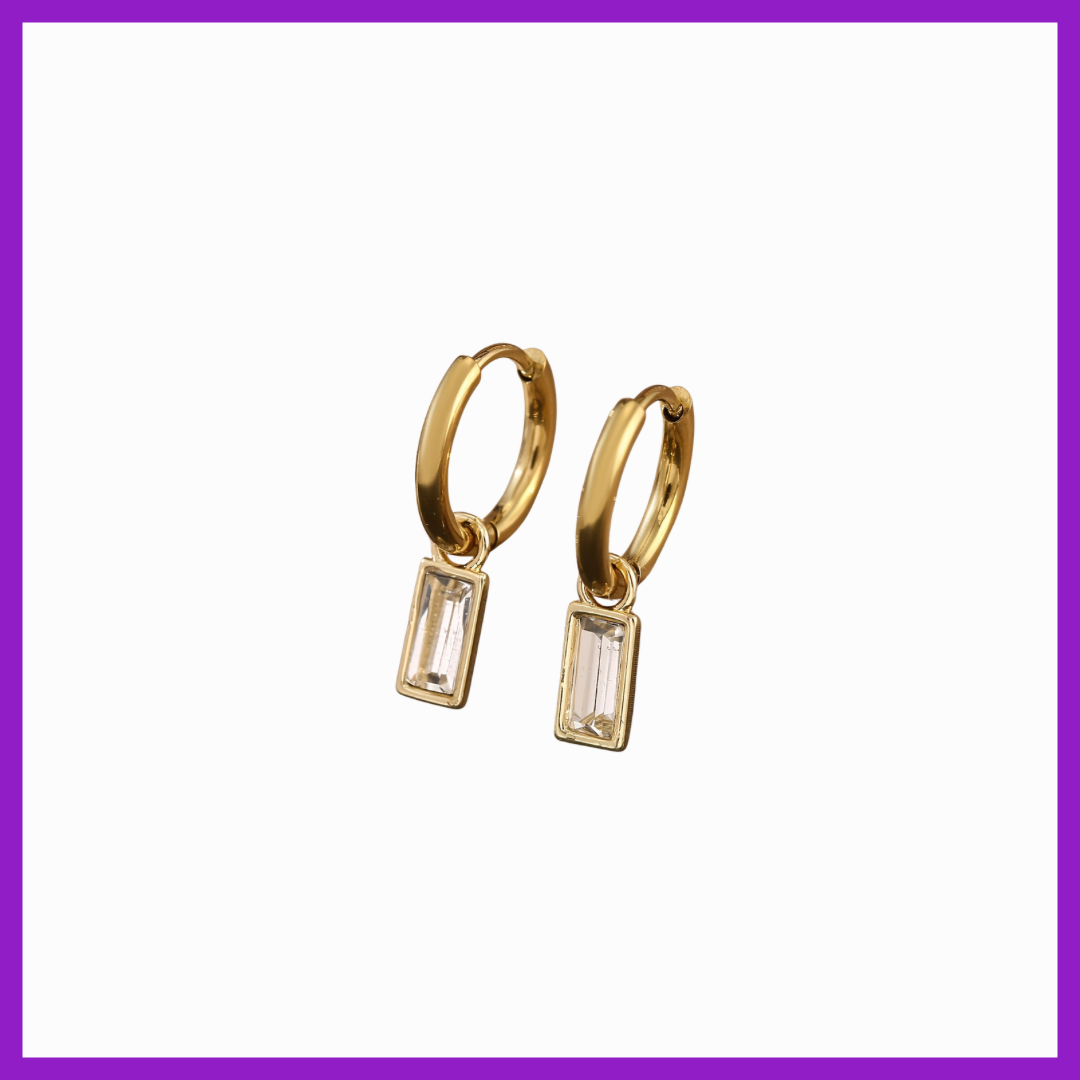 Gold hoop earrings with rectangular gemstones on a white background