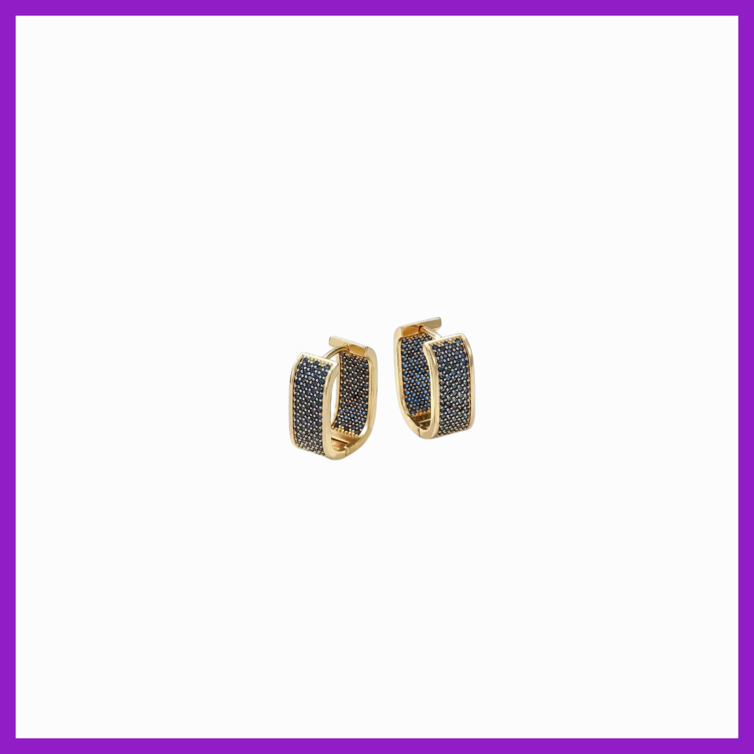 Gold hoop earrings with black stones on a white background