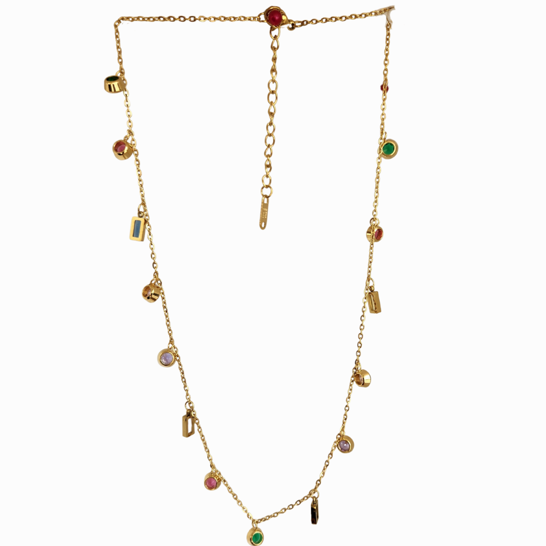 Gold necklace with colorful beads on a white background