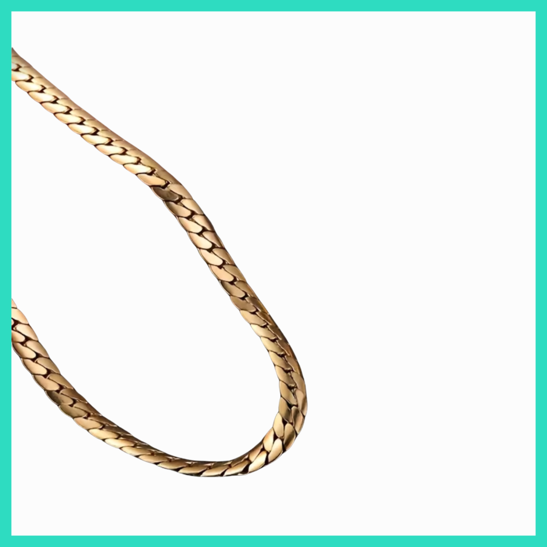 Gold chain necklace on a white background