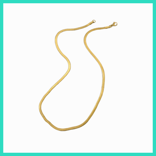 Gold necklace on a white background