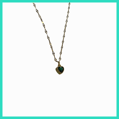 Necklace with a heart-shaped green gemstone pendant on a white background