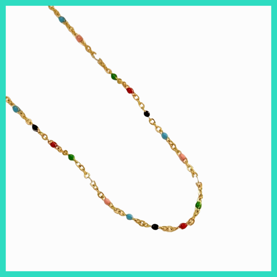 Gold chain necklace with colorful beads on a white background
