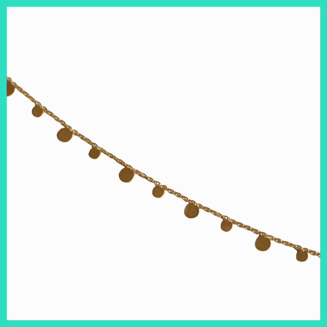 Gold chain with round pendants on a white background
