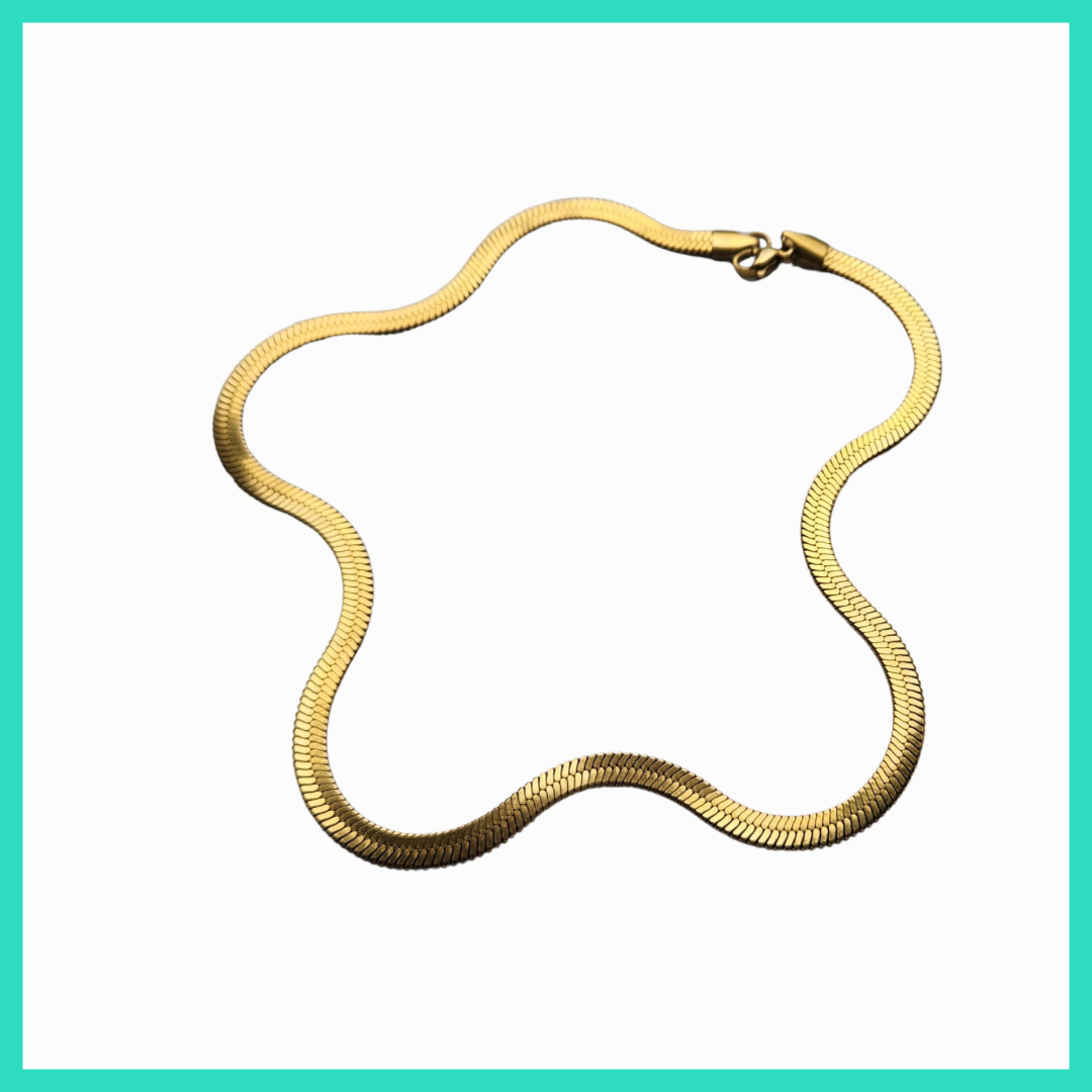 Gold chain necklace on a white background