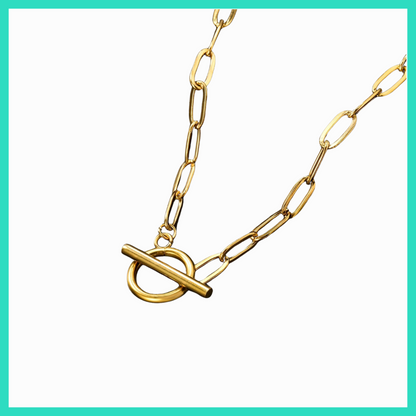 Gold chain necklace with a clasp on a white background