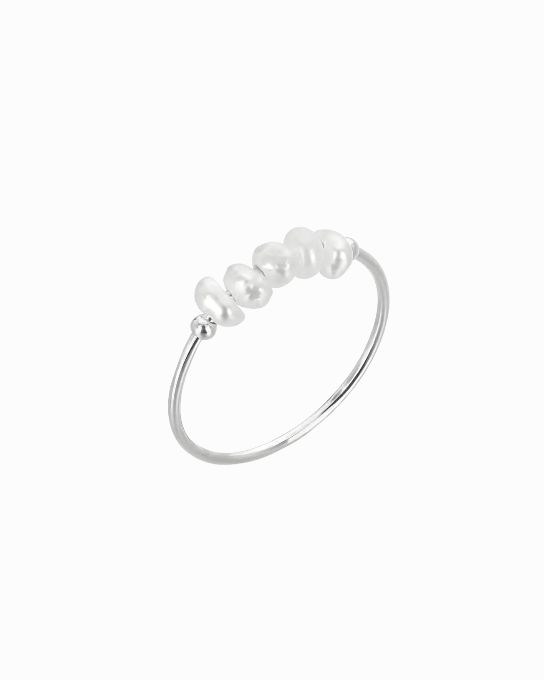 Silver ring with pearls on a white background