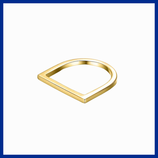 Gold ring with a unique geometric design on a white background