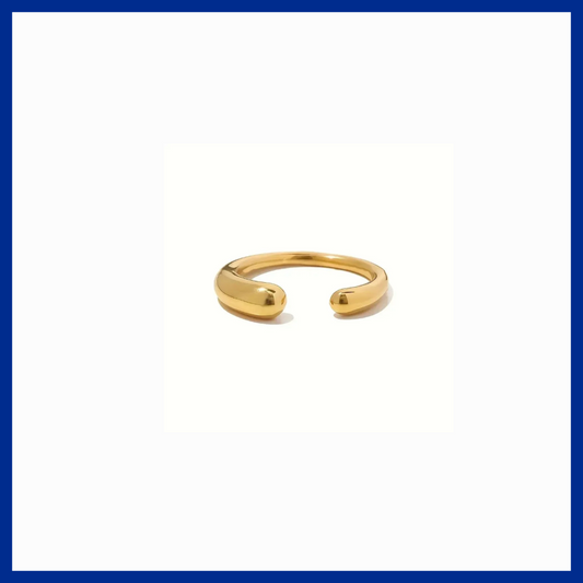 Gold open ring on a white background