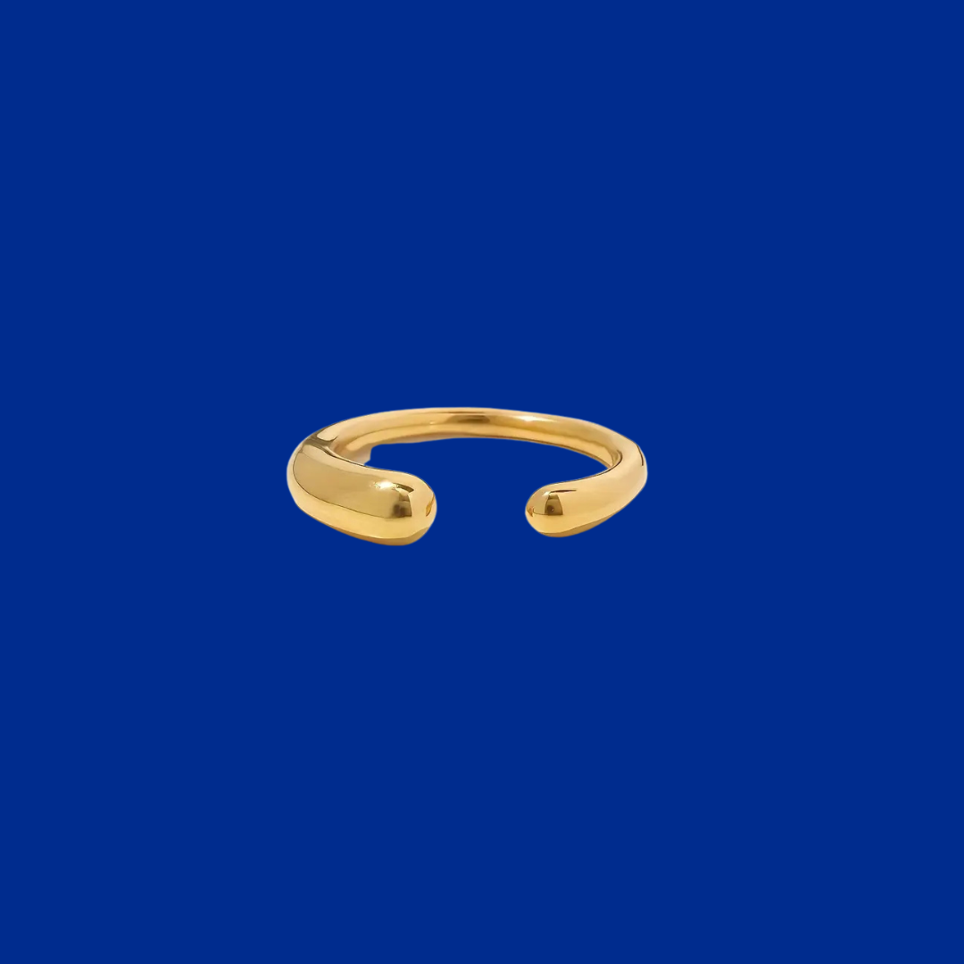 Gold open ring on a blue background