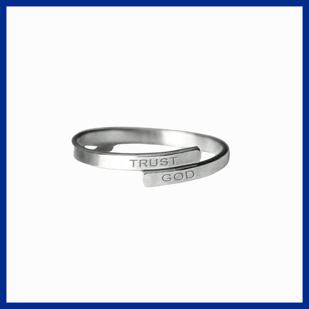 Silver open ring with 'TRUST GOD' engraving on a white background