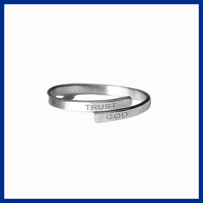 Silver open ring with 'TRUST GOD' engraving on a white background