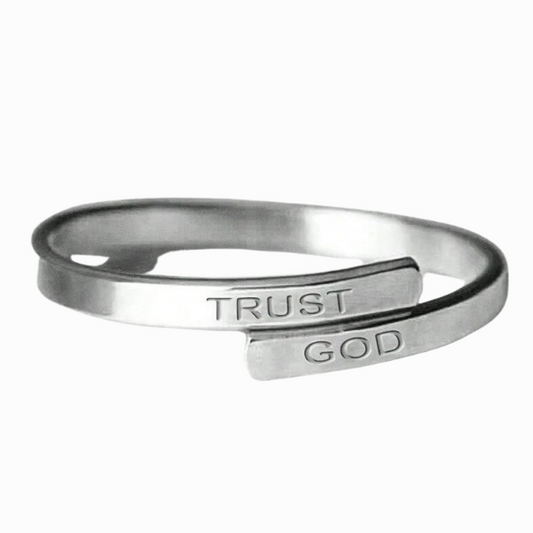 Silver open ring with 'TRUST GOD' engraving on a white background