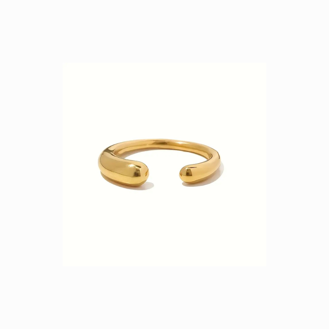 Gold open ring on a white background