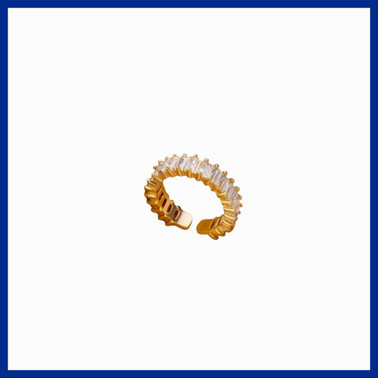 Gold hoop earring with clear gemstones on a white background