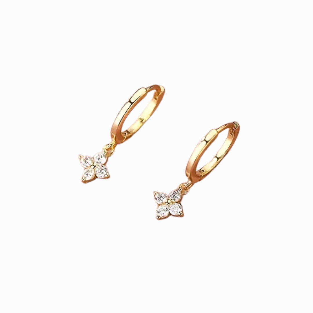 Gold hoop earrings on a white background